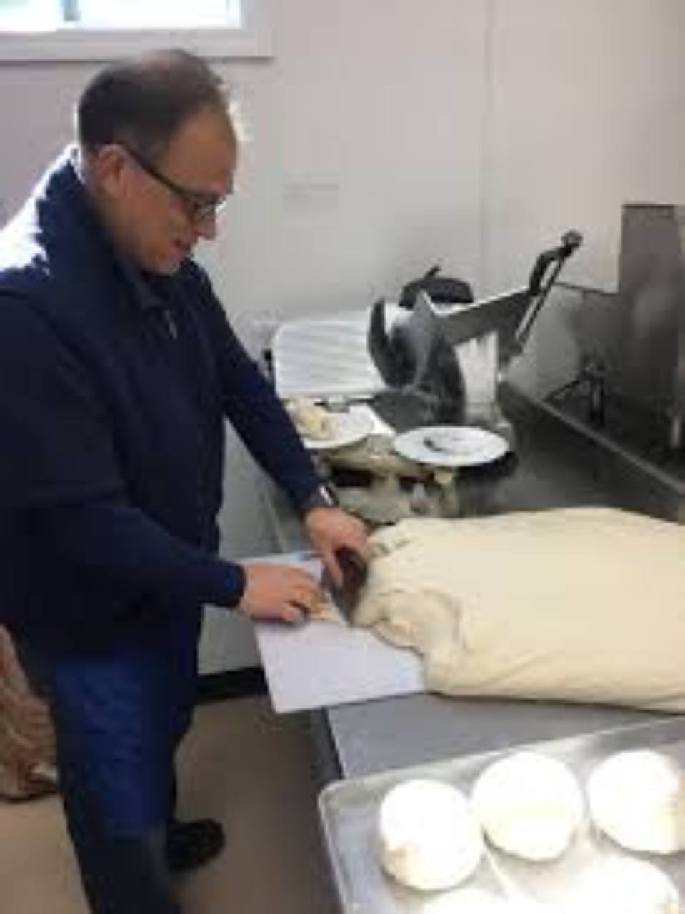 Fresh pizza dough being prepared in the Sunapee Pizza Chef kitchen.